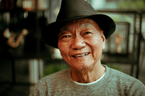 Older asian man, happy after mindfulness coaching